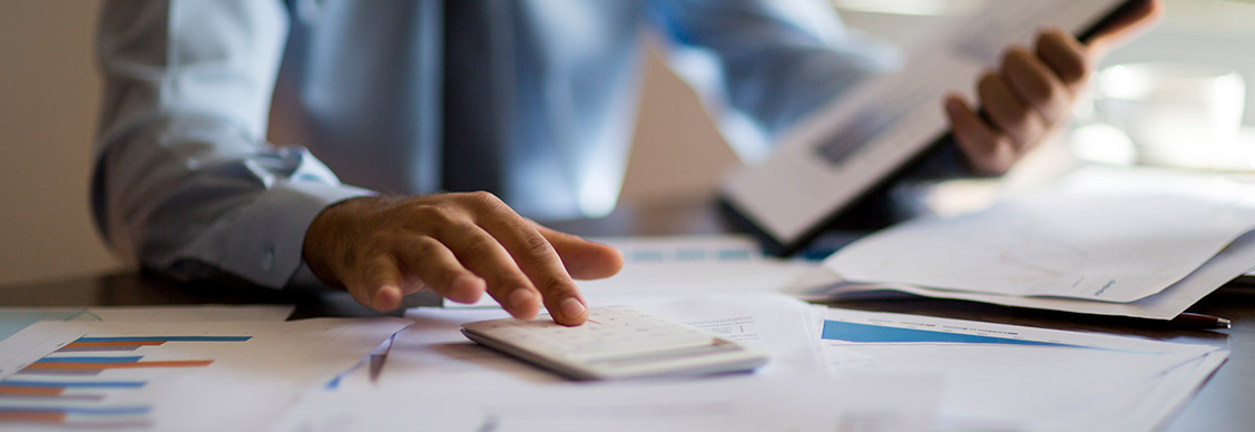 Close-up of a businessman doing calculations