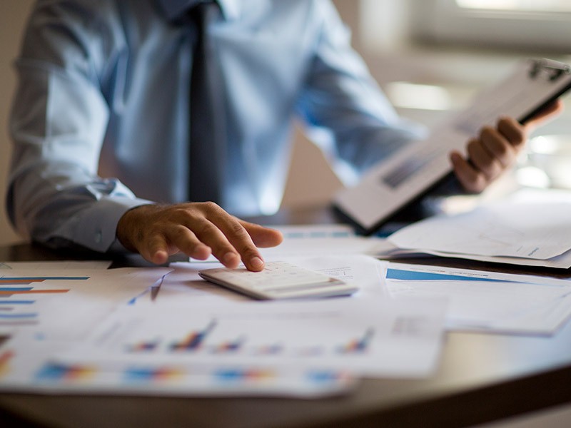 Close-up of a businessman doing calculations