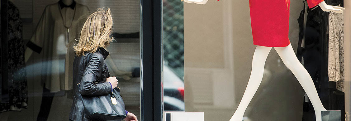 A woman looking in shop window