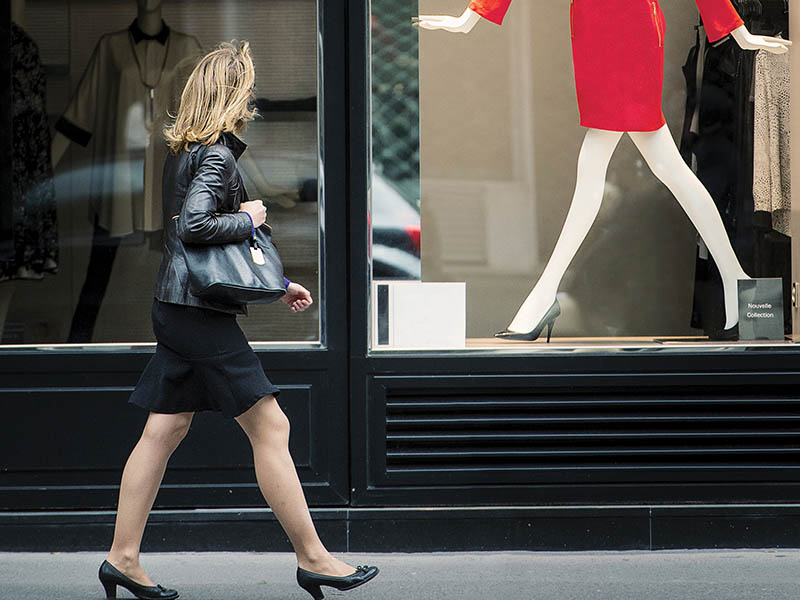 A woman looking in shop window