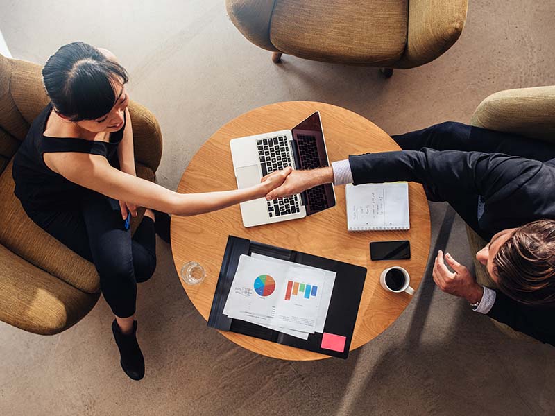 Business people shake hands