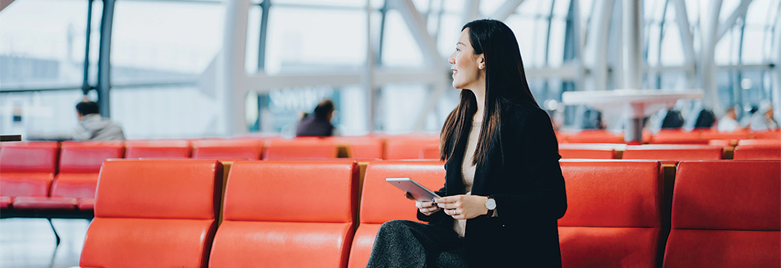 A women at airport waiting for a flight
