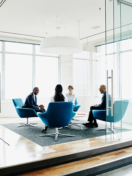 Team of businesspeople discussing project in office conference room