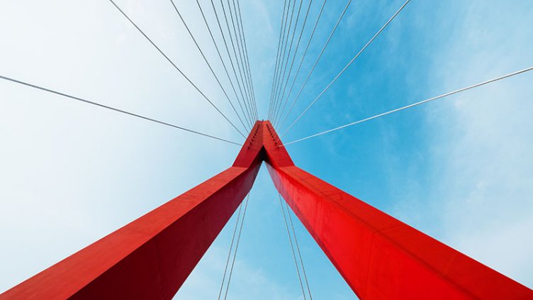 A close-up photo of a red bridge