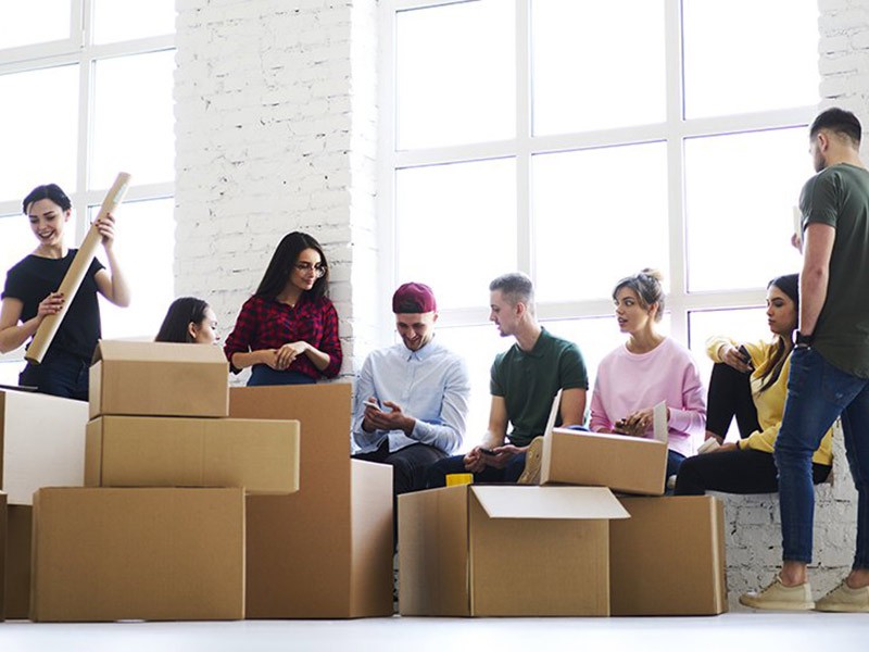 Employees packing boxes for an office relocation
