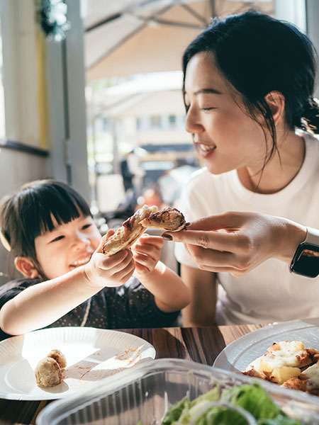 lady having snacks with her kid