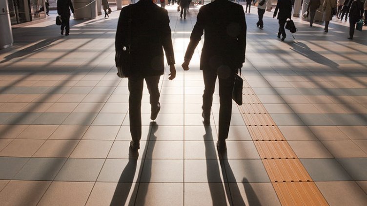 two businessmen walking