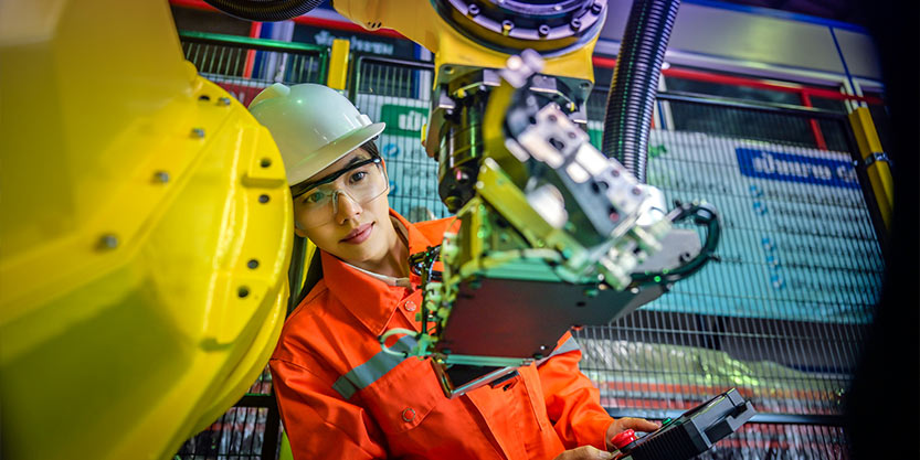 Woman is looking into a machine