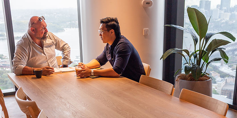 Two men discussing in office