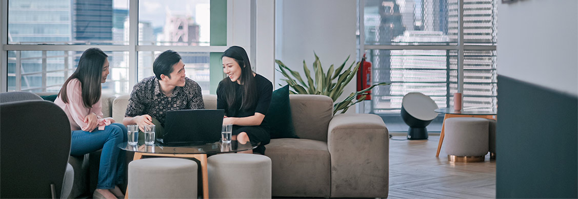 Employees working and smiling at each other