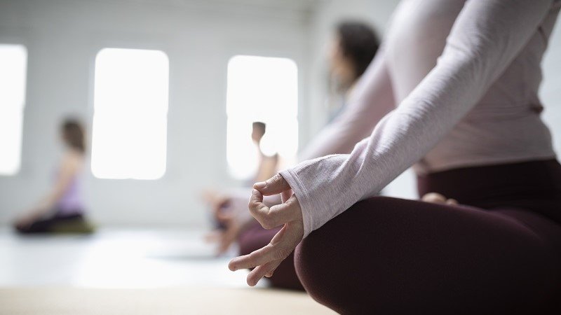 Women doing yoga in hotel premises