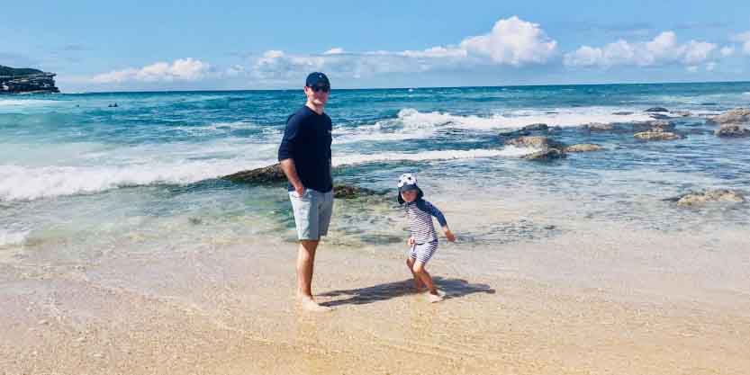 Father and his children having fun at the beach