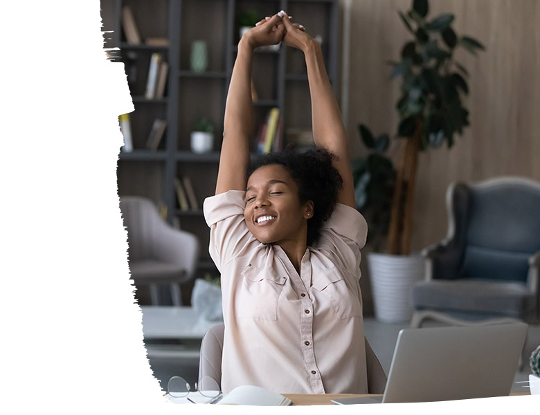 Woman working in a casual office, stretching