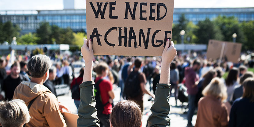 Group of people carrying sign boards