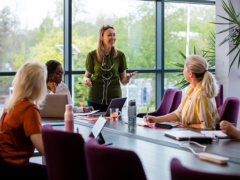 Group of diverse women in a business meeting.