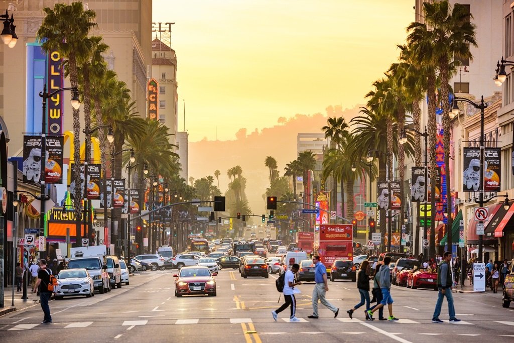 LOS ANGELES, CALIFORNIA - MARCH 1, 2016: Traffic and pedestrians on Hollywood Boulevard at dusk. The theater district is famous tourist attraction.; Shutterstock ID 434708779; Departmental Cost Code : 162800; Project Code: GBLMKT; PO Number: GBLMKT