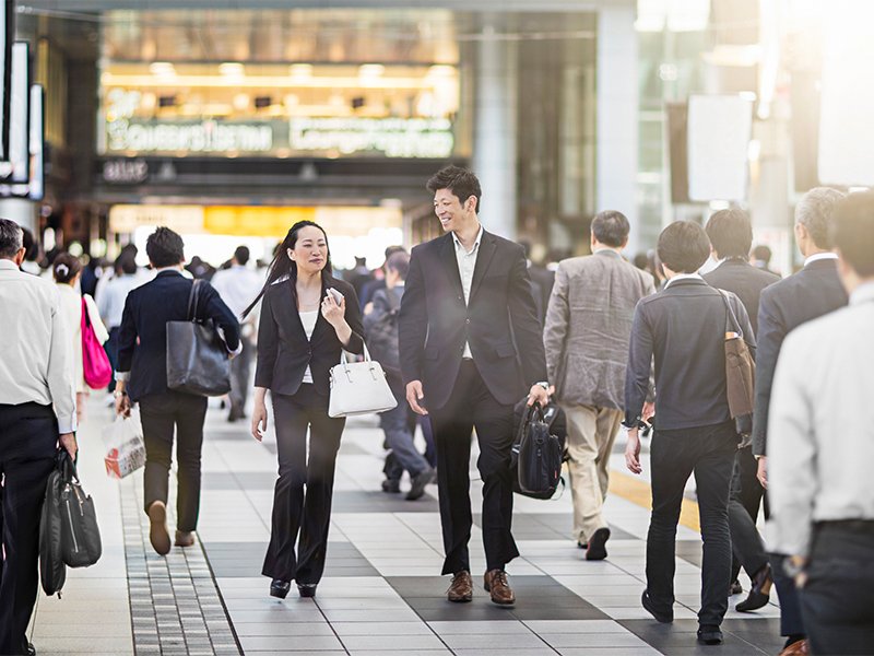 Two employees going to the office in morning by waling on the street