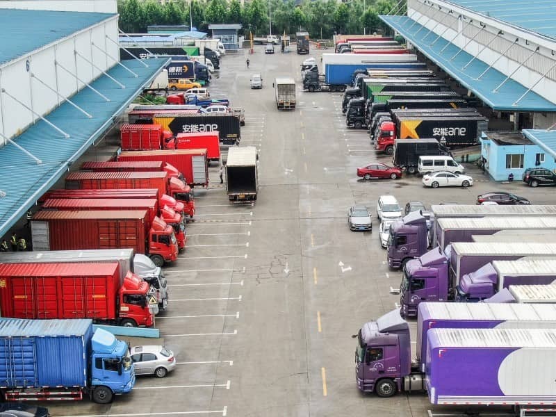 Logistics trucks outside a warehouse