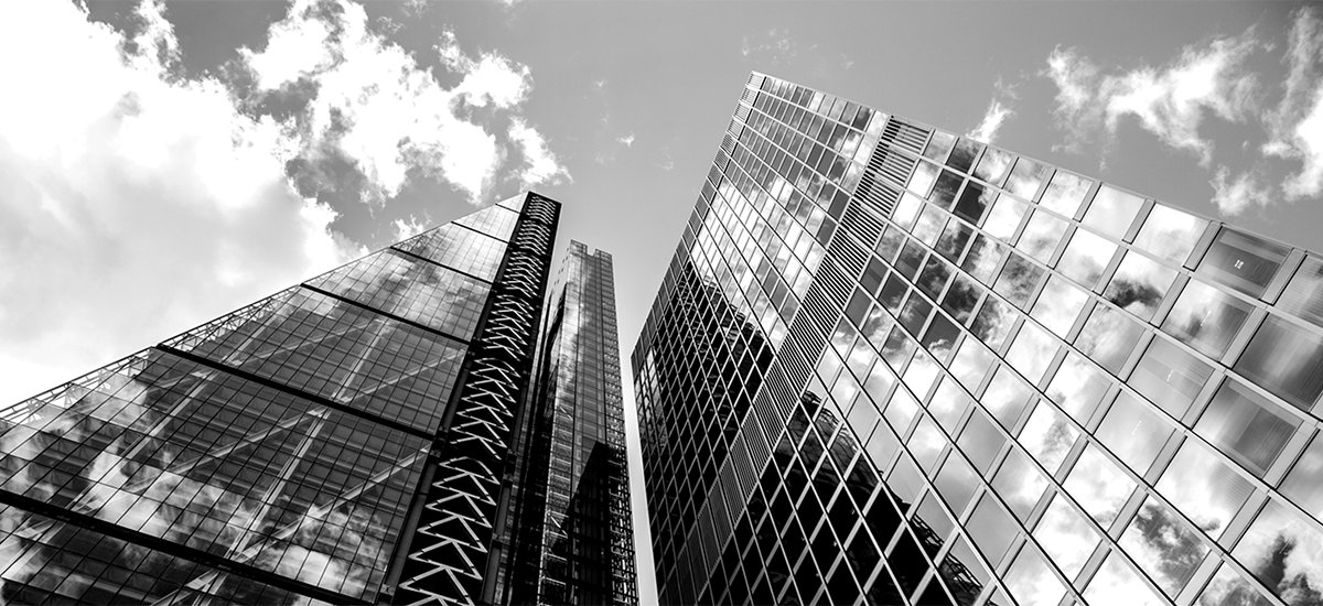 View of high rise real estate glass buildings from bottom