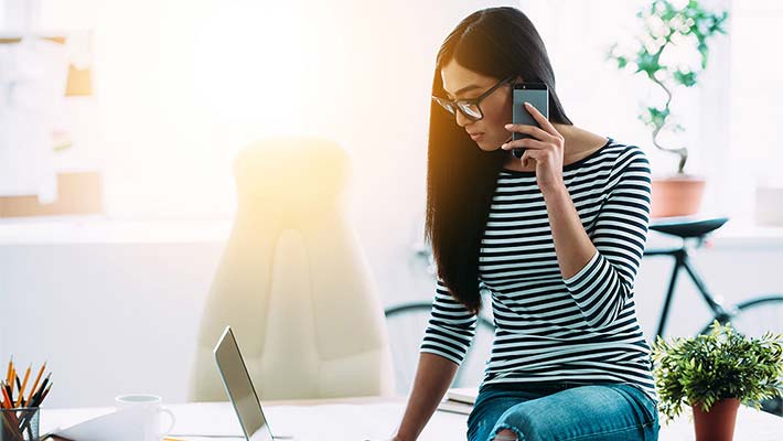 Lady talking over the phone while working