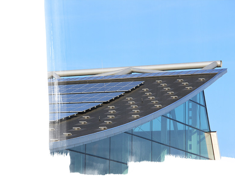 Glass building with solar panels on roof